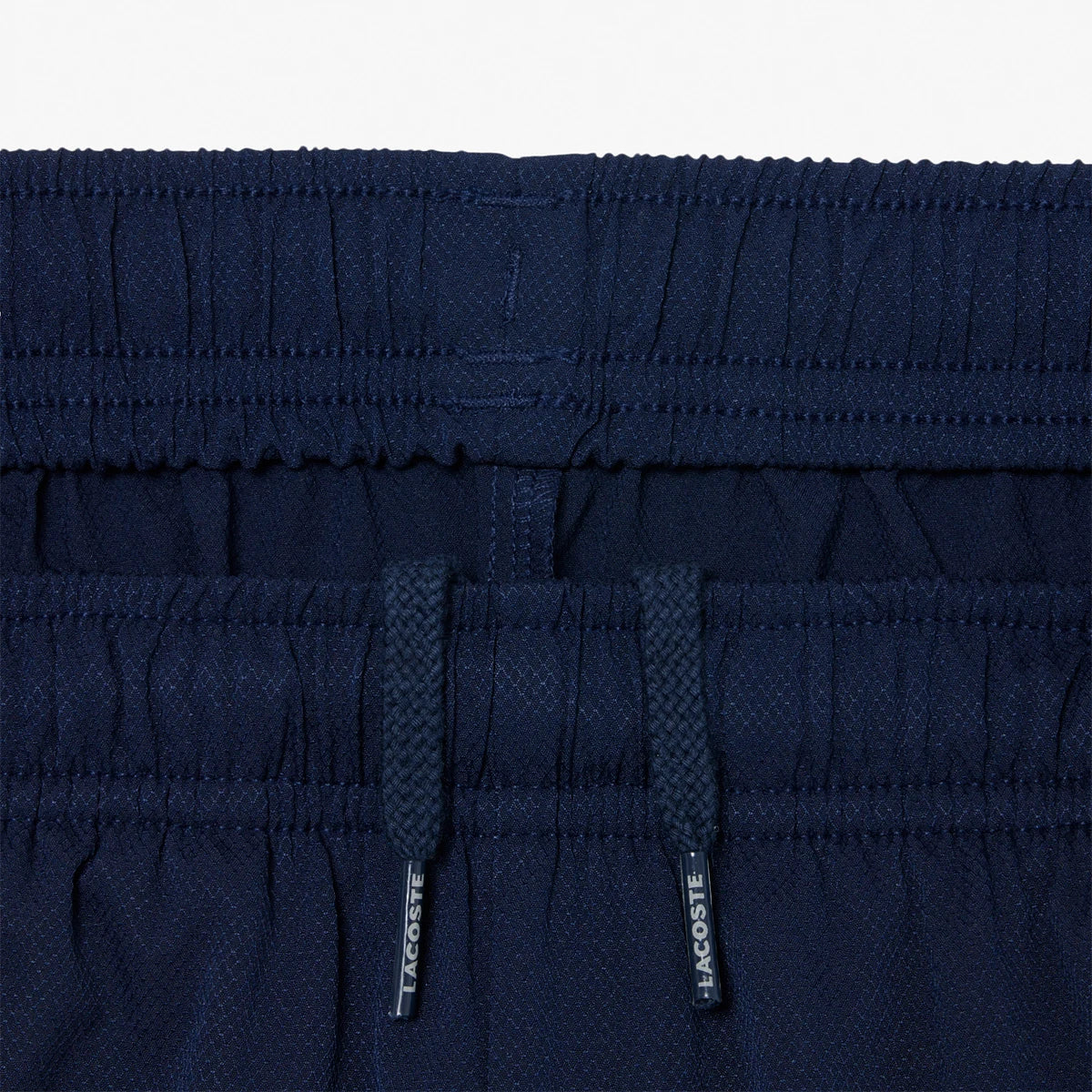 PANTALÓN CORTO LACOSTE ROLAND-GARROS JUNIOR BALL KID